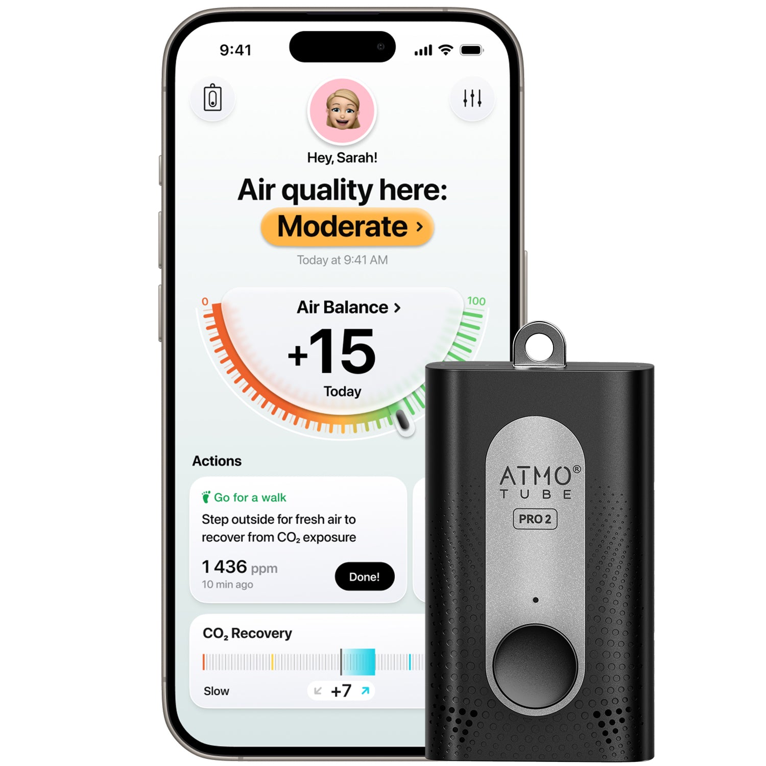 Smartphone displaying air quality app showing ‘Air quality here: Moderate’ and ‘Air Balance +15 today,’ alongside a black Atmotube PRO 2 portable air quality monitor